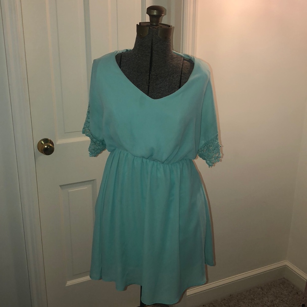 Teal dress with lace bell sleeves